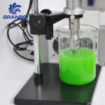 Granbo ultrasonic homogenizer probe dispersing liquid on a laboratory stand